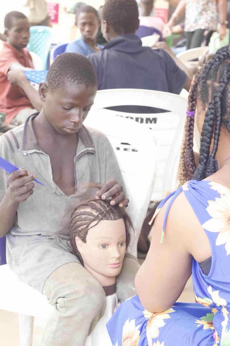 Students practicing hairdressing skills